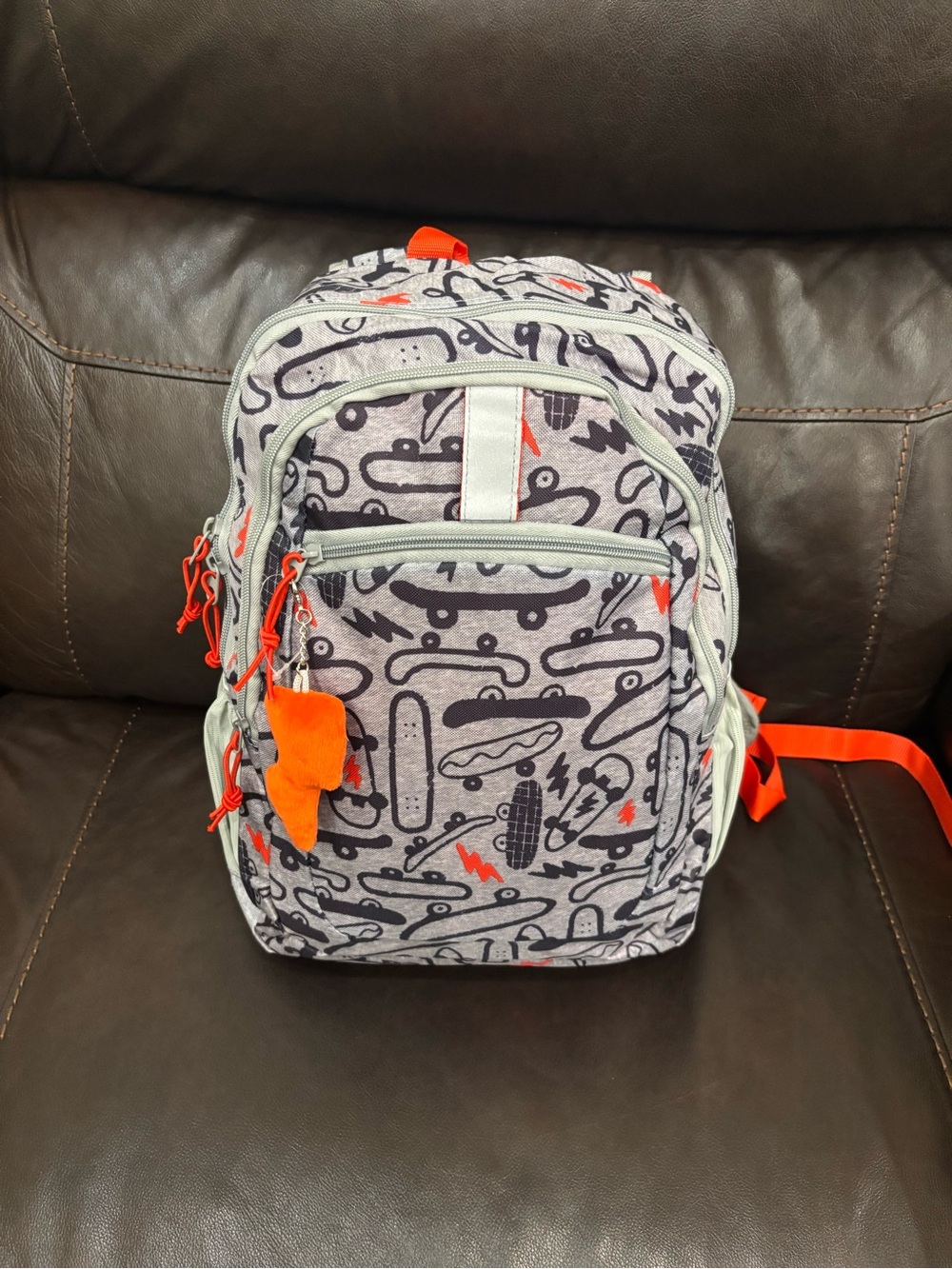 New with tags Kids Skateboard Print Backpack in Gray with Orange Accents